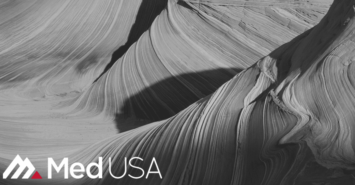 image of slot canyon black and white landscape with red and white med usa logo for outsourcing patient calls