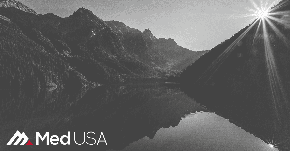 image of river with hills and trees with Med USA logo white and red
