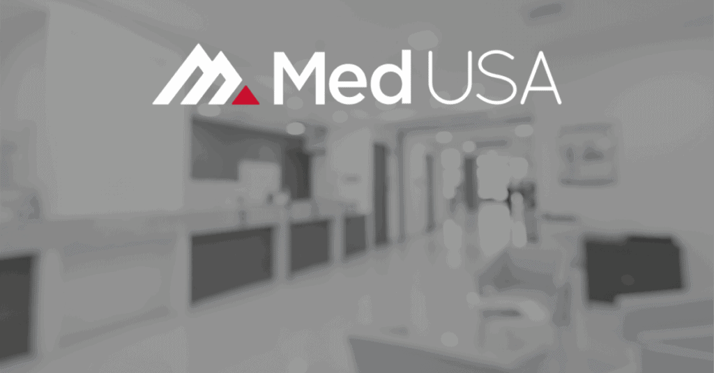 blurry background image of a medical practice outsourcing revenue cycle management with white and red med usa logo
