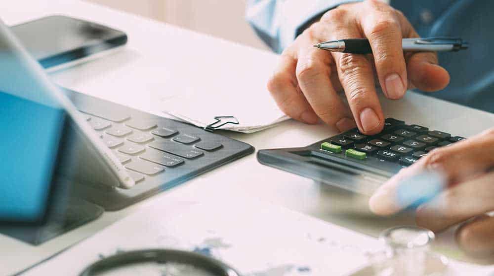 Man using a calculator Man using a calculator