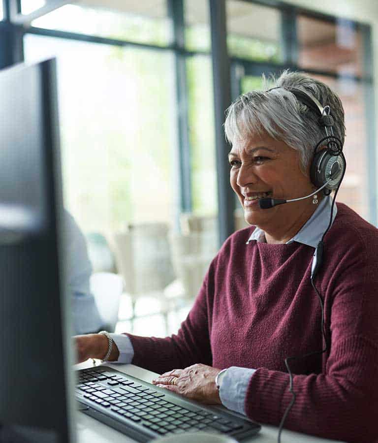 Mature woman using computer Mature woman using computer