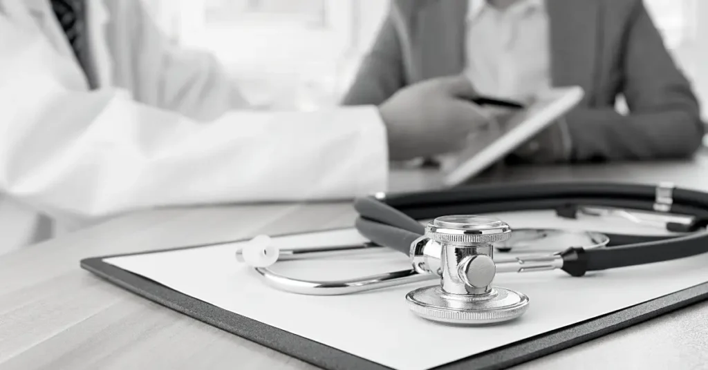 A doctor's stethoscope rests on a clipboard, symbolizing medical practice and patient care.