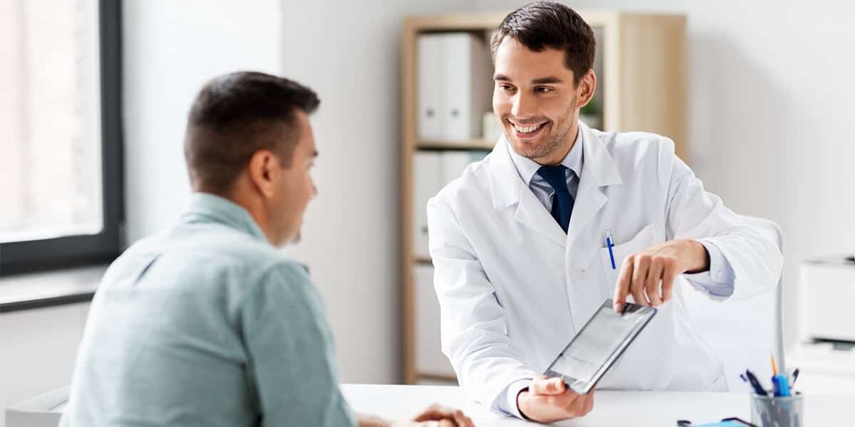 A healthcare provider showing a patient information on a tablet