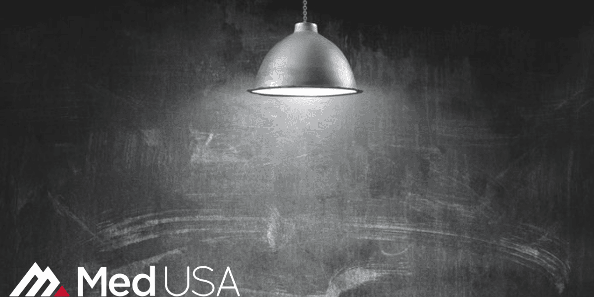 image of chalkboard and hanging light with EHR electronic health records Med USA logo