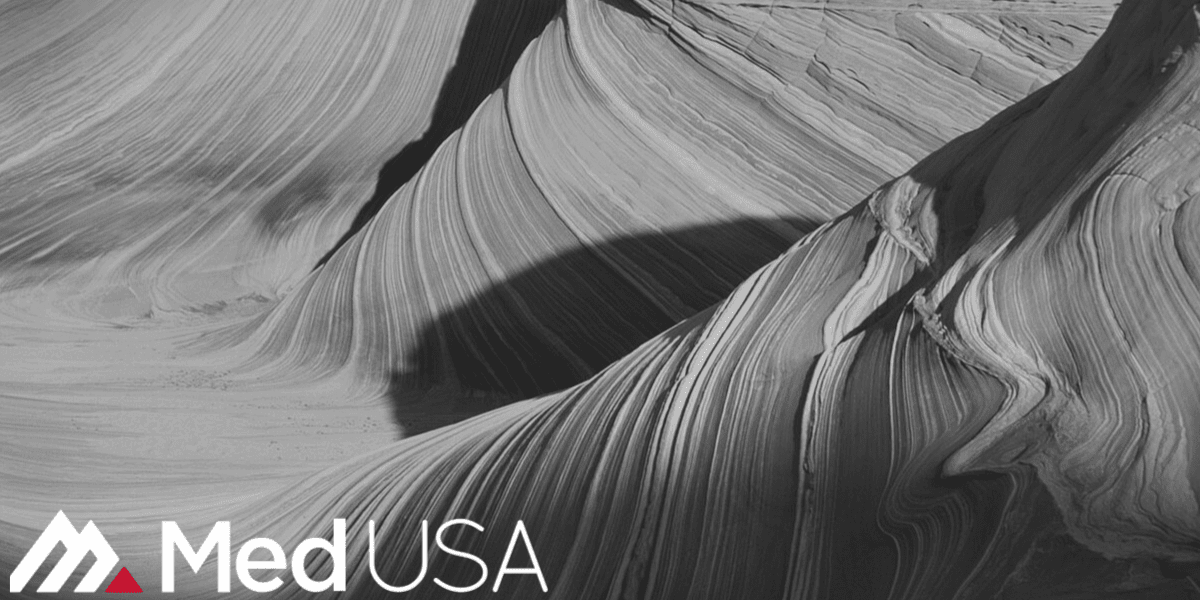 image of slot canyon black and white landscape with red and white med usa logo for outsourcing patient calls