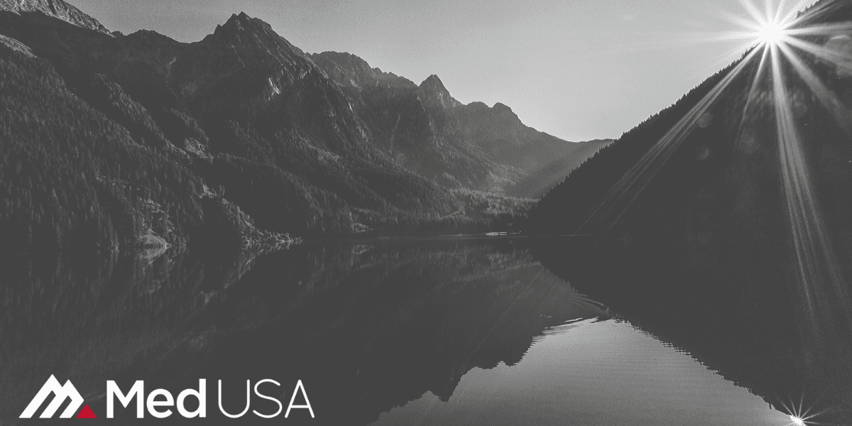 image of river with hills and trees with Med USA logo white and red